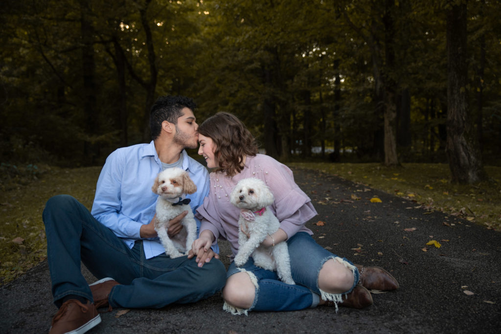 Kissing on forehead at engagement session with dogs by Klem Photography Nashville Wedding Photographer
