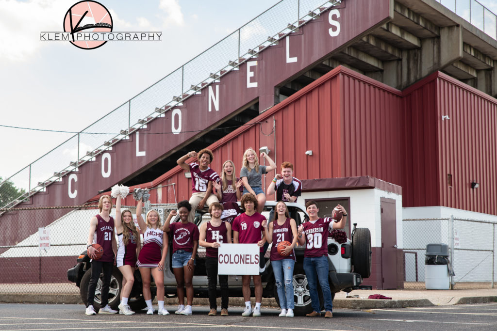 kentucky seniors in front of football stadium at henderson County High School for senior pictures kentucky 