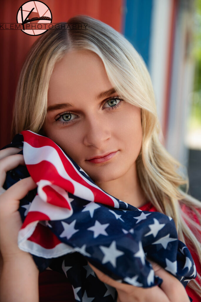 Close-up of senior girl with patriotic makeup and accessories for senior pictures near Evansville.